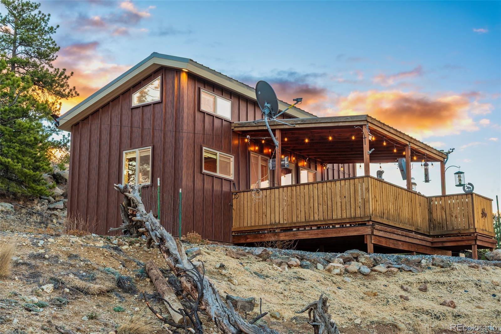 189 Goldenburg Canyon Road Hartsel, CO 80449 - Photo 24 of 36 a front view of a house with wooden fence