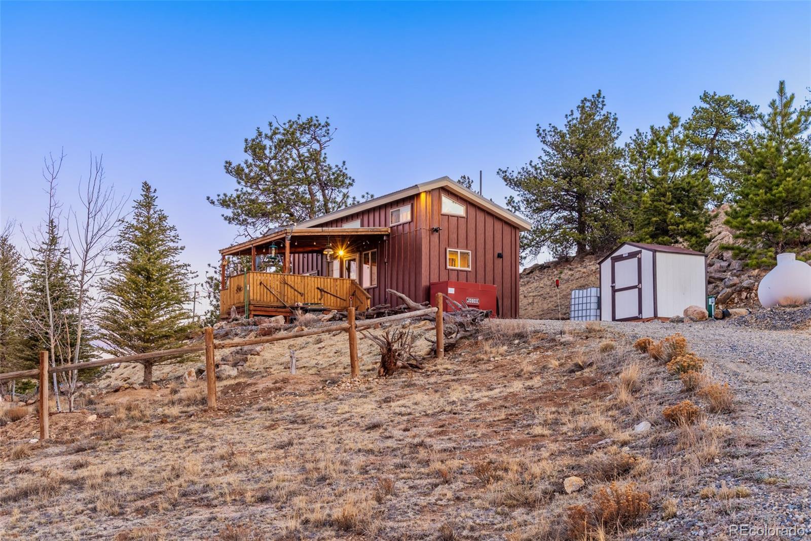189 Goldenburg Canyon Road Hartsel, CO 80449 - Photo 26 of 36 a view of a house with a yard and sitting area