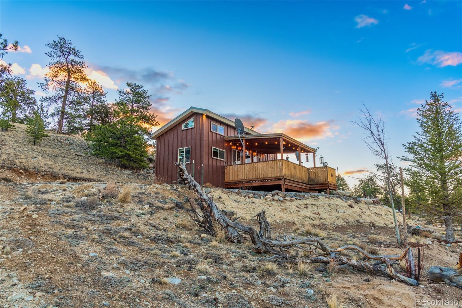189 Goldenburg Canyon Road Hartsel, CO 80449 - Photo 28 of 36 a view of a house with a yard