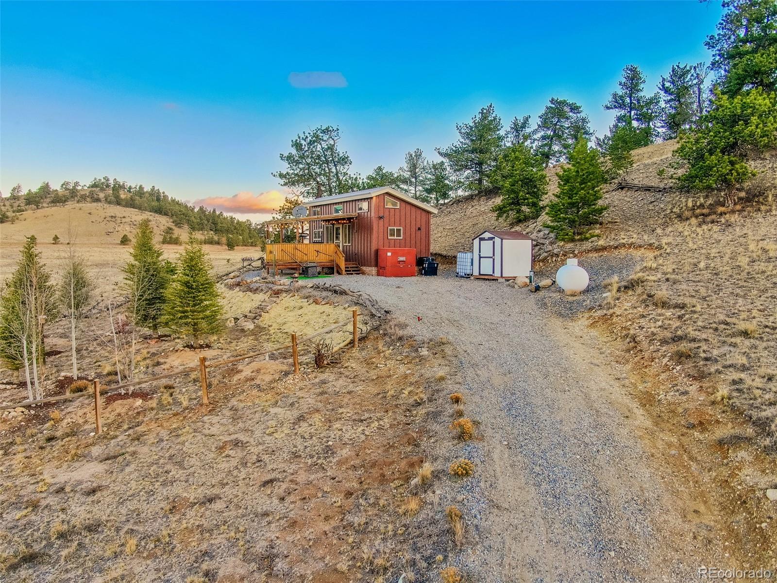 189 Goldenburg Canyon Road Hartsel, CO 80449 - Photo 31 of 36 a view of a house with a yard
