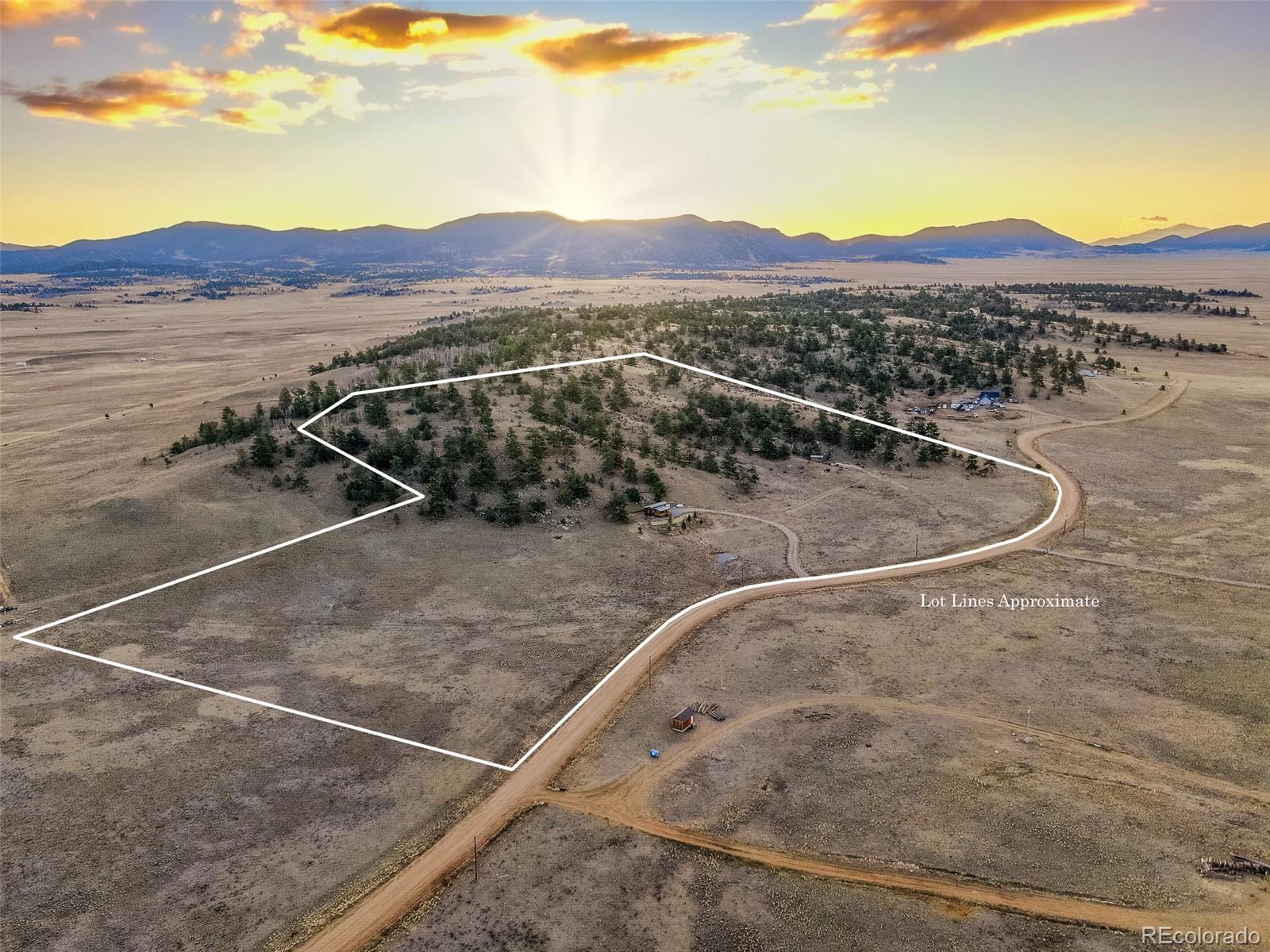 189 Goldenburg Canyon Road Hartsel, CO 80449 - Photo 33 of 36 a view of a backyard with a fireplace