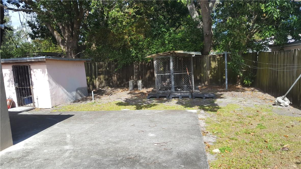325 Northwest 56th Street Miami, FL 33127 - Photo 3 of 5 a view of back yard of the house
