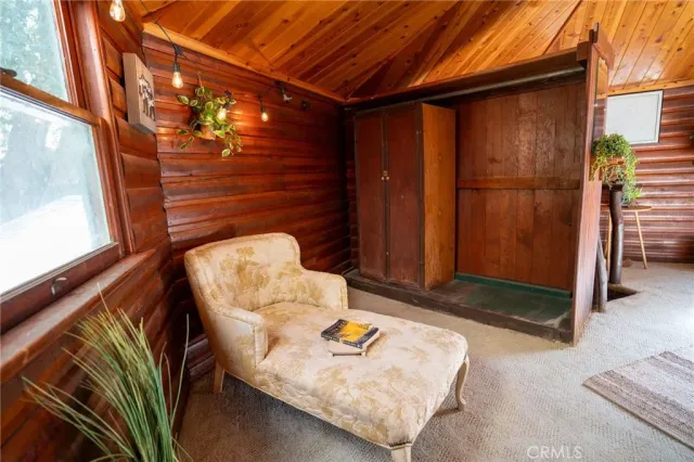 a view of a floor to ceiling window with a chair in front of it