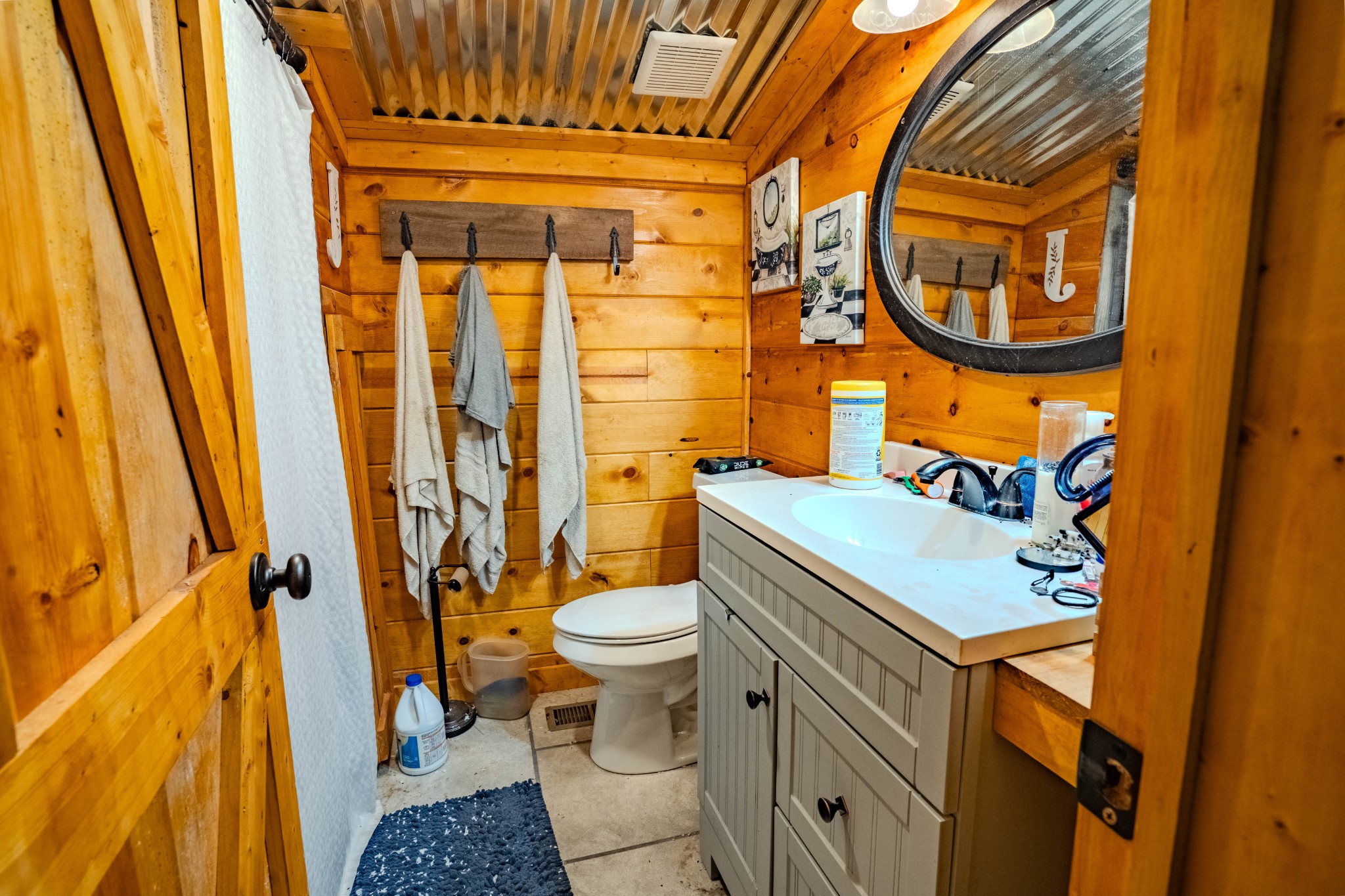 2167 Powdermill Hill Road Lawrenceburg, TN 38464 - Photo 17 of 33 a bathroom with a sink and a mirror