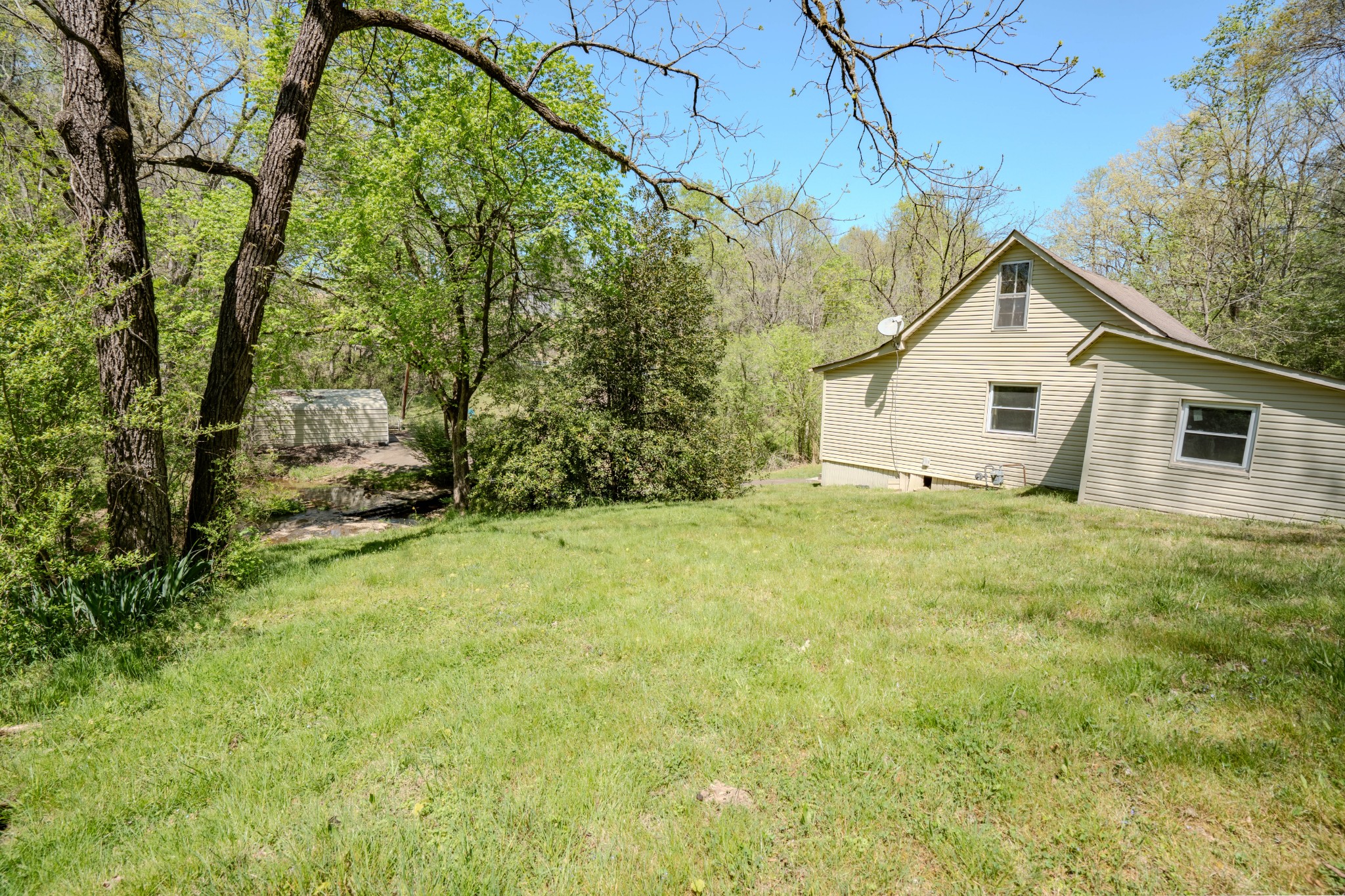 2167 Powdermill Hill Road Lawrenceburg, TN 38464 - Photo 18 of 33 a house view with a garden space
