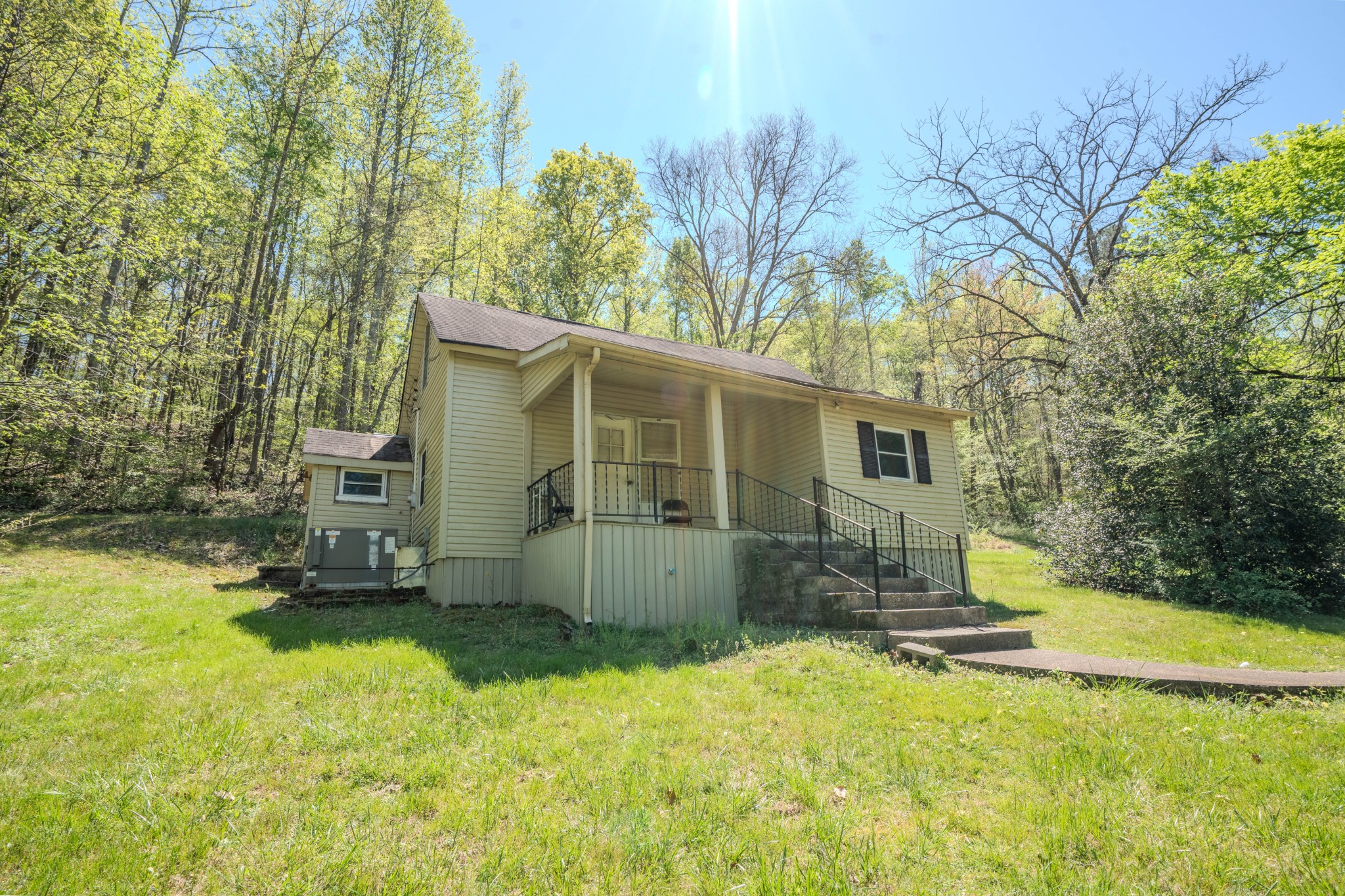 2167 Powdermill Hill Road Lawrenceburg, TN 38464 - Photo 19 of 33 a view of a house with a yard