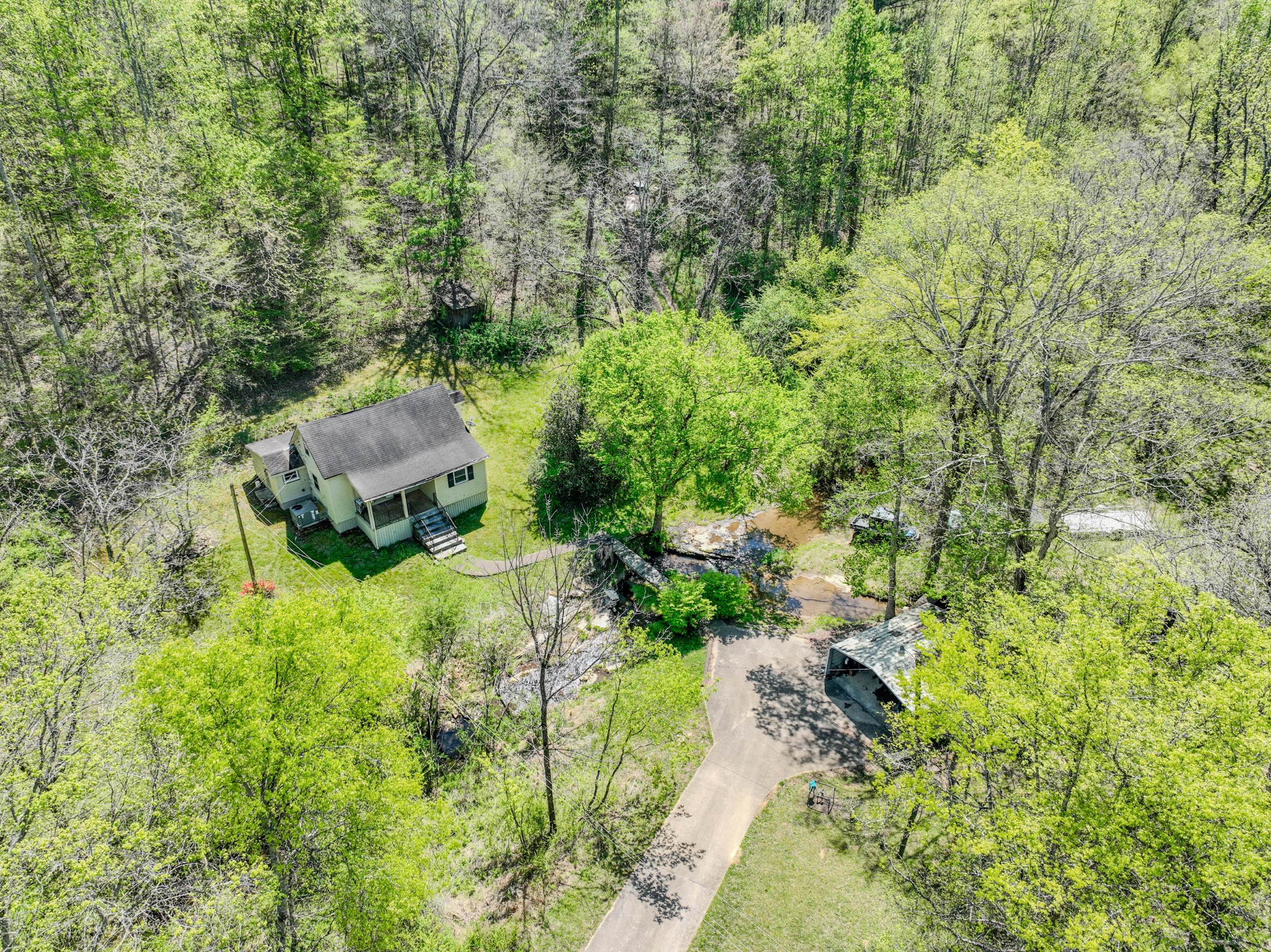 2167 Powdermill Hill Road Lawrenceburg, TN 38464 - Photo 2 of 33 a garden view with a seating space
