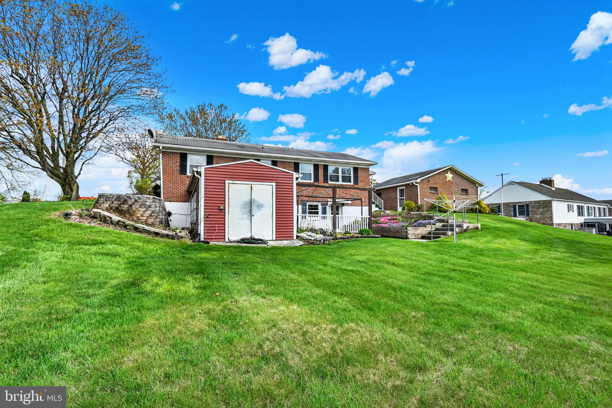 33 Ridge Avenue Biglerville, PA 17307 - Photo 11 of 38 Charming hillside home with lush greenery.