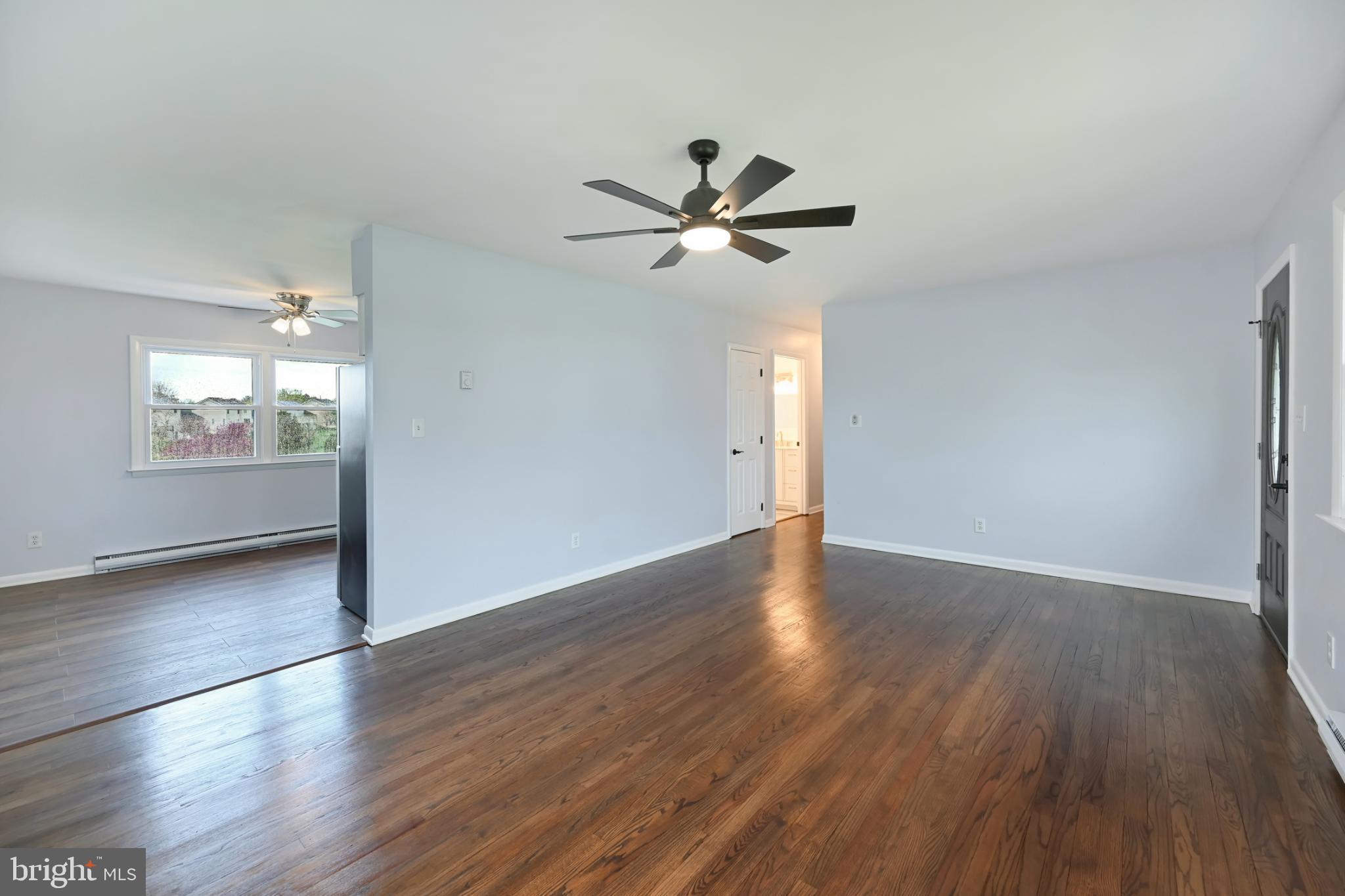 33 Ridge Avenue Biglerville, PA 17307 - Photo 15 of 38 Spacious, sunlit living area with hardwood floors.