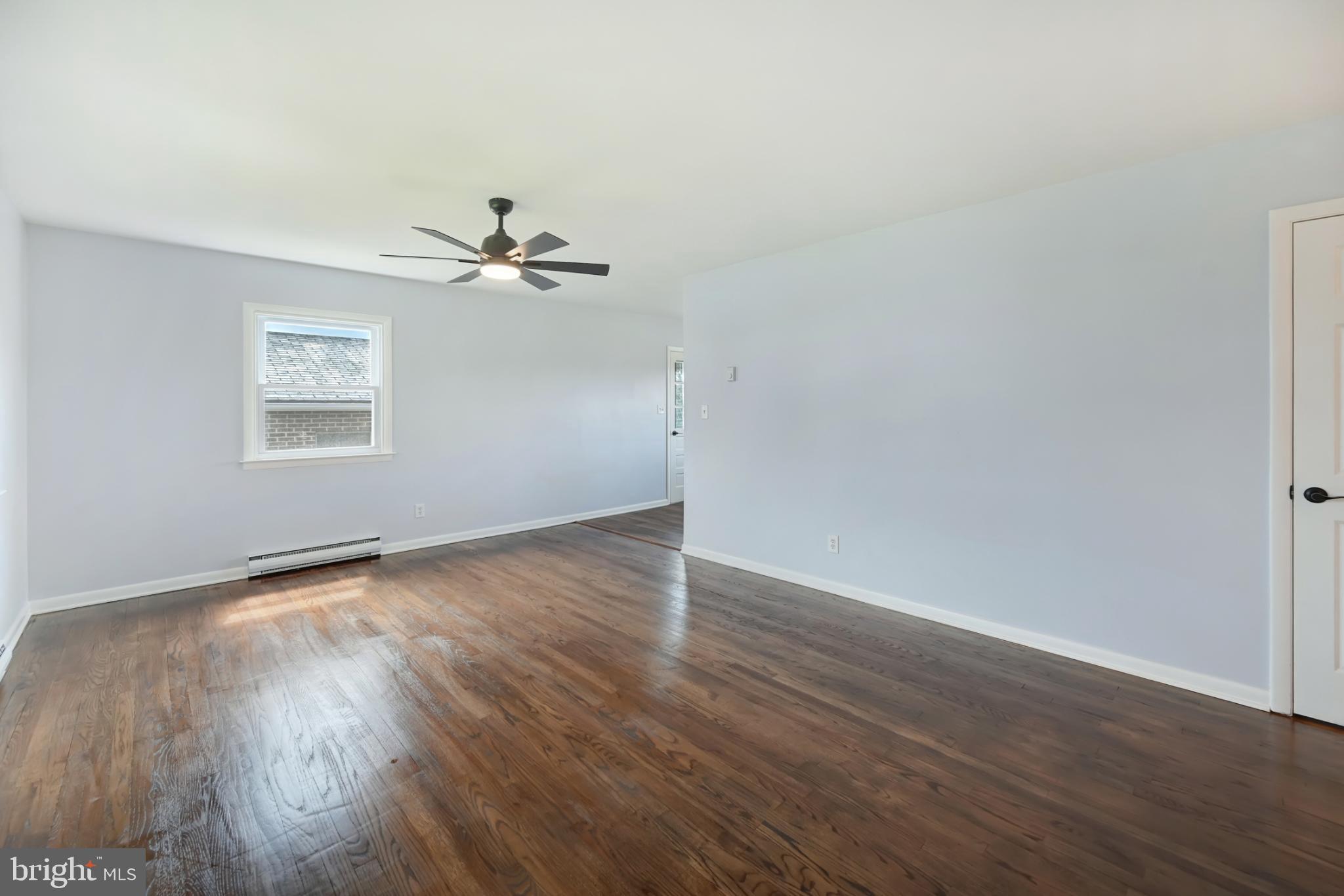 33 Ridge Avenue Biglerville, PA 17307 - Photo 16 of 38 Spacious, sunlit room with hardwood floors.