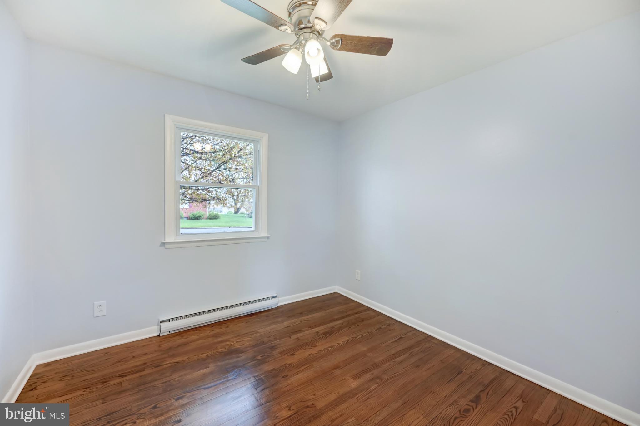 33 Ridge Avenue Biglerville, PA 17307 - Photo 26 of 38 Bright and airy room with hardwood floors.