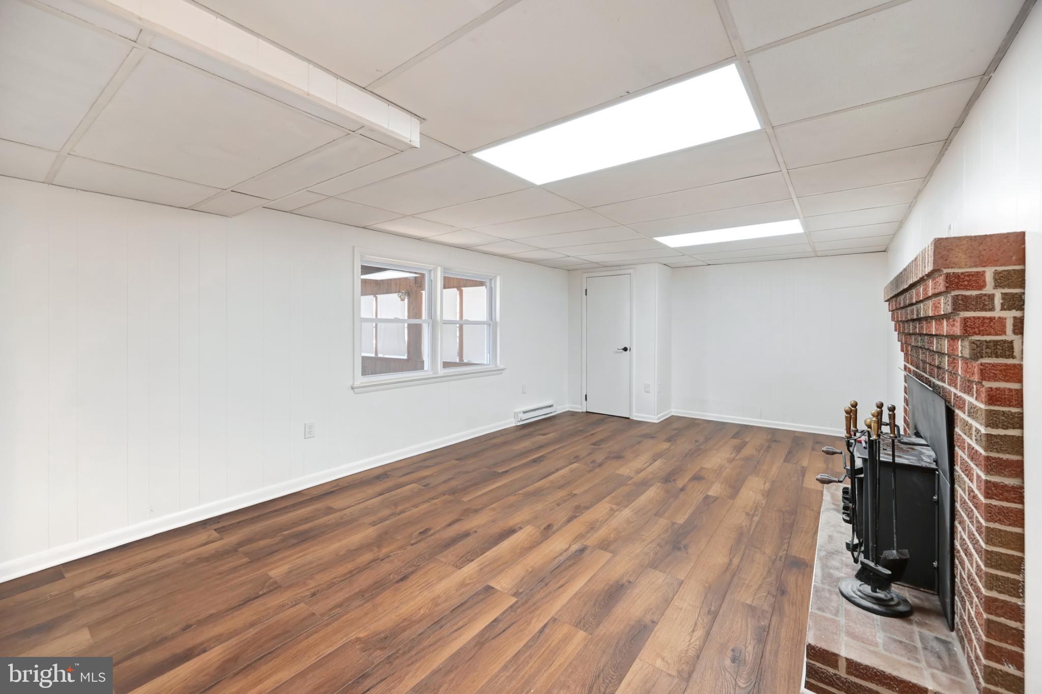 33 Ridge Avenue Biglerville, PA 17307 - Photo 32 of 38 Spacious, bright room with warm wood floors.