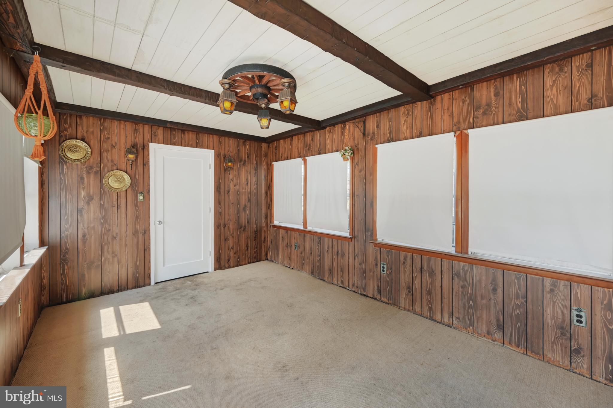 33 Ridge Avenue Biglerville, PA 17307 - Photo 36 of 38 Charming sunlit room with rustic wood accents.