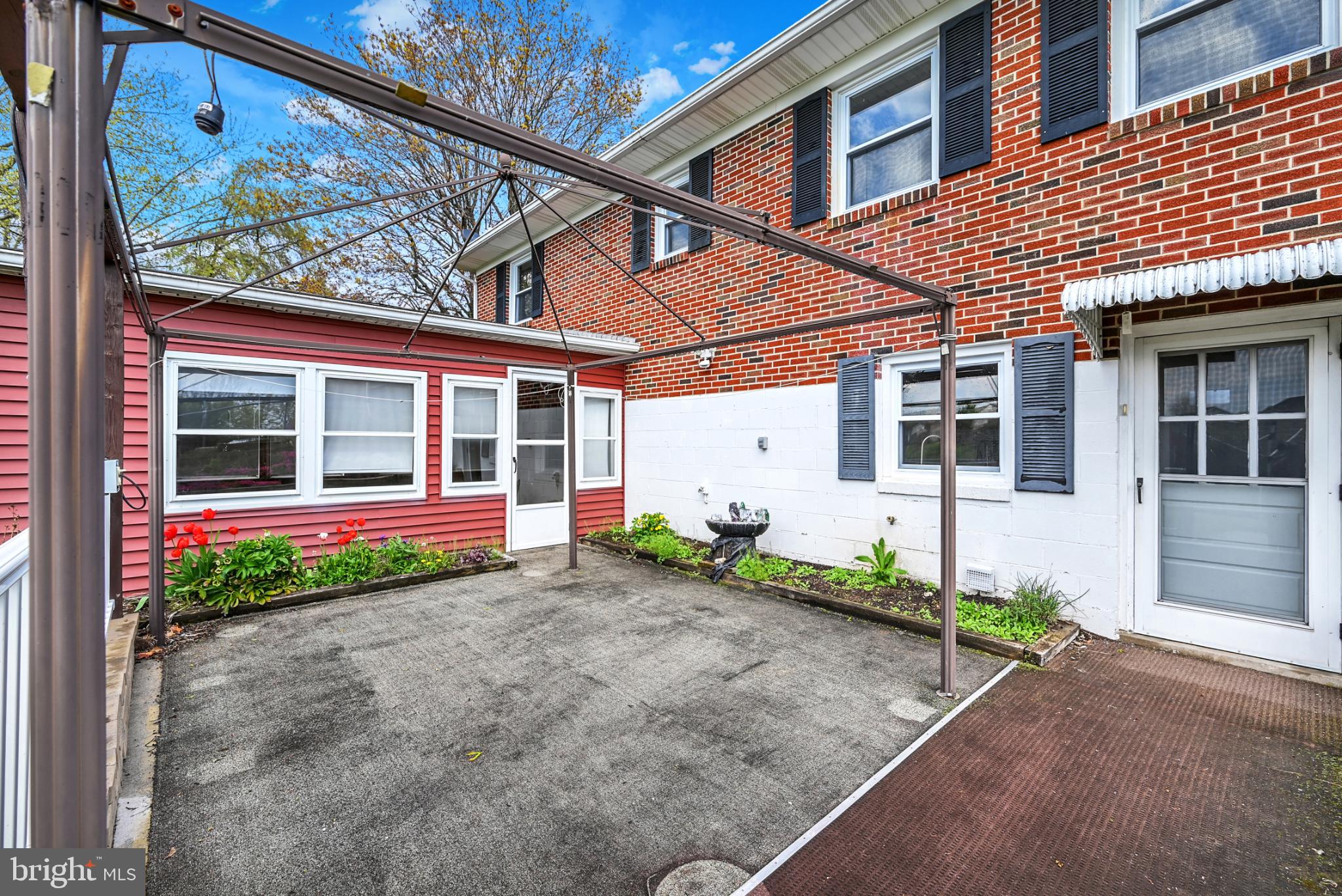 33 Ridge Avenue Biglerville, PA 17307 - Photo 38 of 38 Charming courtyard with vibrant greenery.