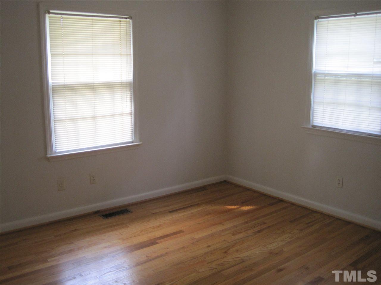 1321 West Core Road Dunn, NC 28334 - Photo 11 of 18 an empty room with a window