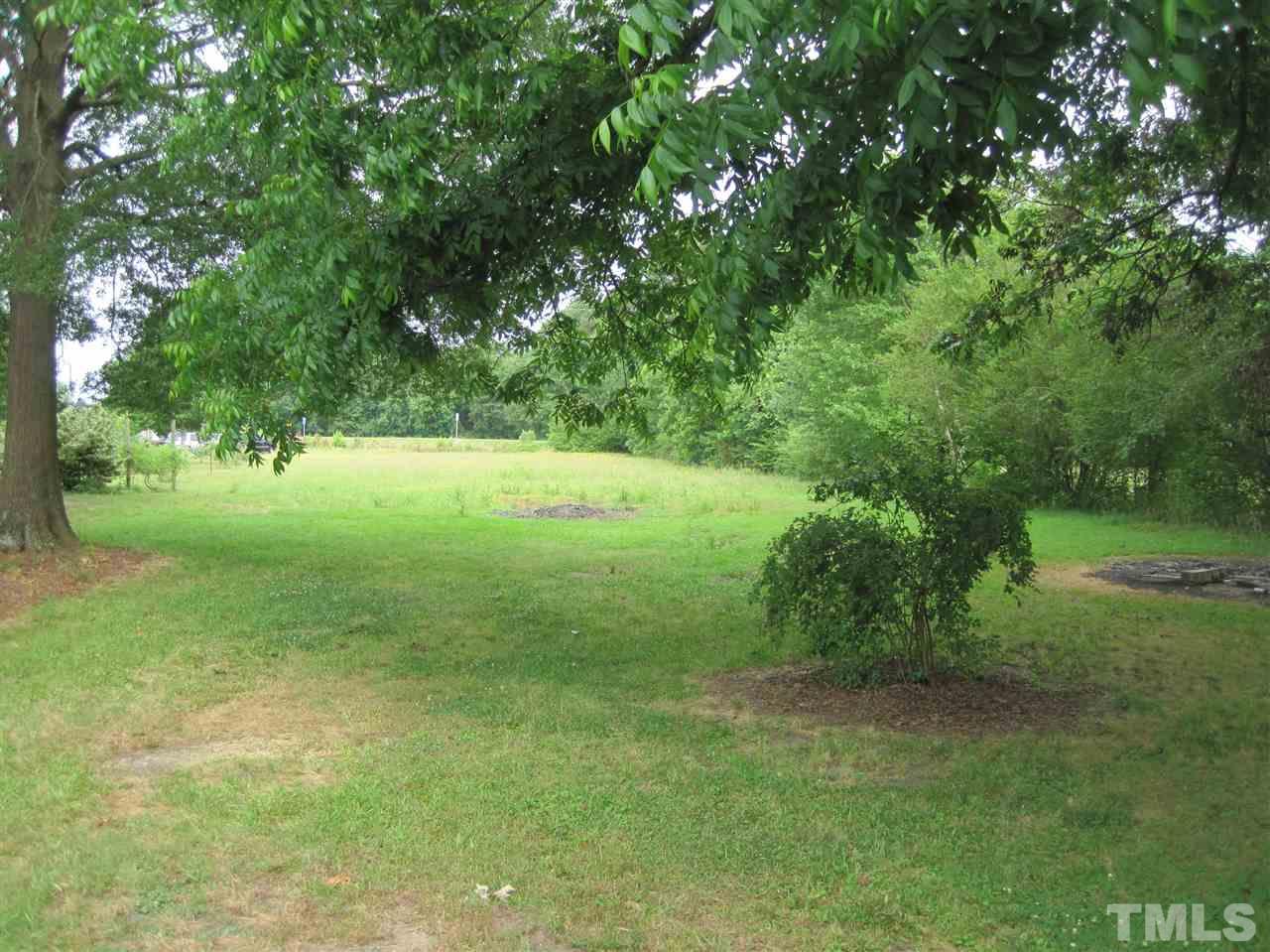 1321 West Core Road Dunn, NC 28334 - Photo 15 of 18 a view of outdoor space with deck and yard