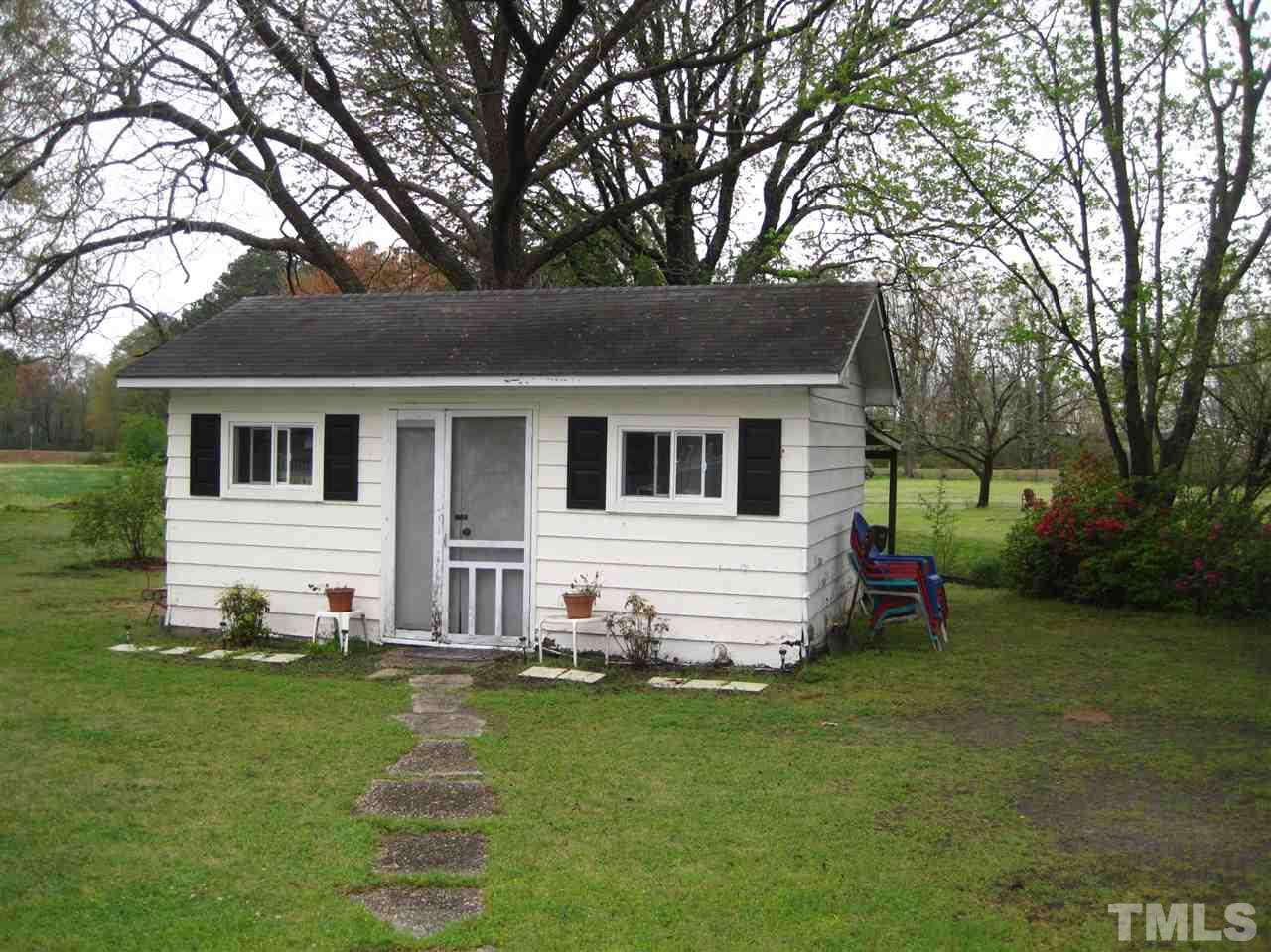 1321 West Core Road Dunn, NC 28334 - Photo 16 of 18 a view of a house with a backyard