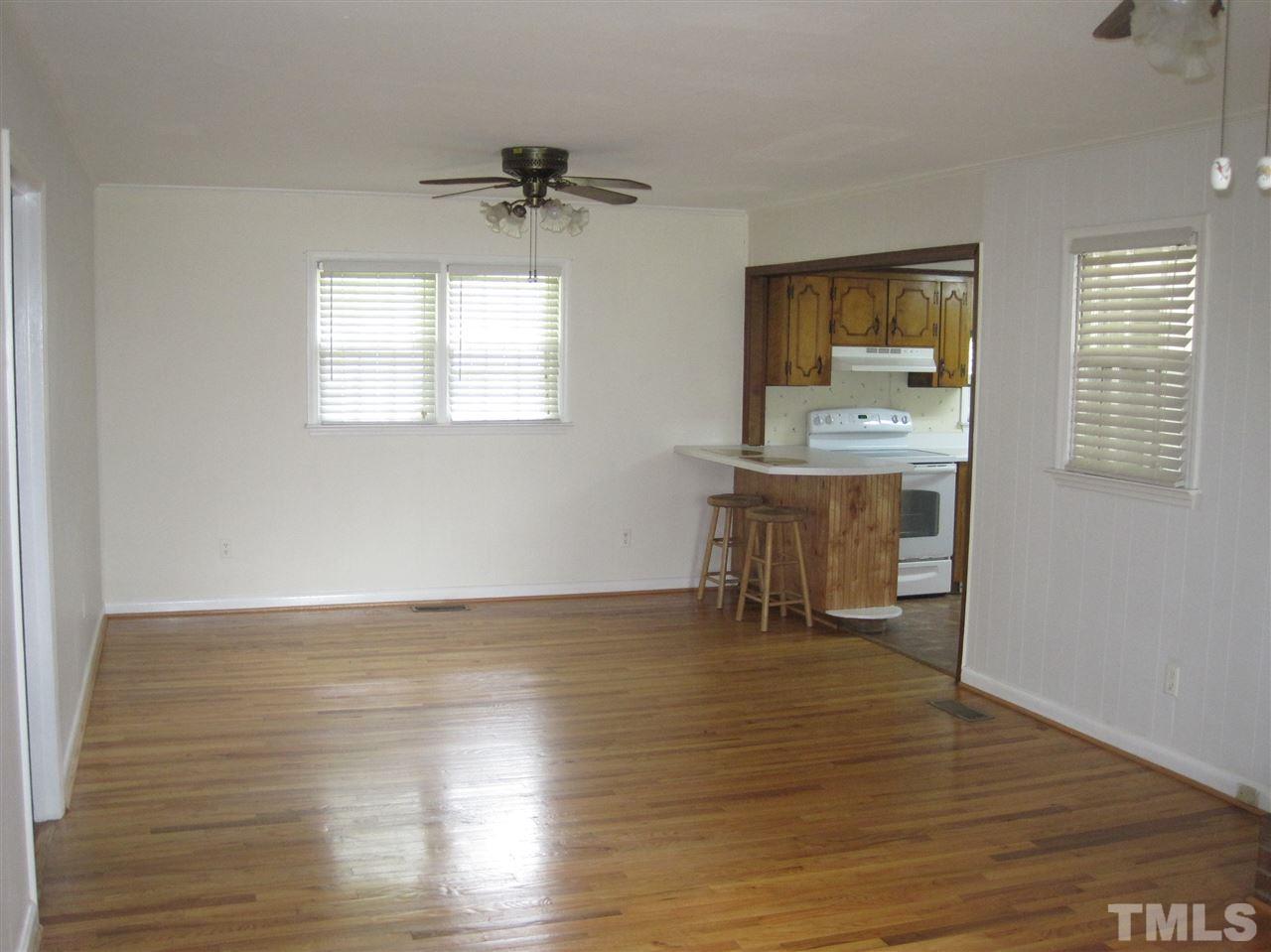 1321 West Core Road Dunn, NC 28334 - Photo 5 of 18 a view of room with window and wooden floor