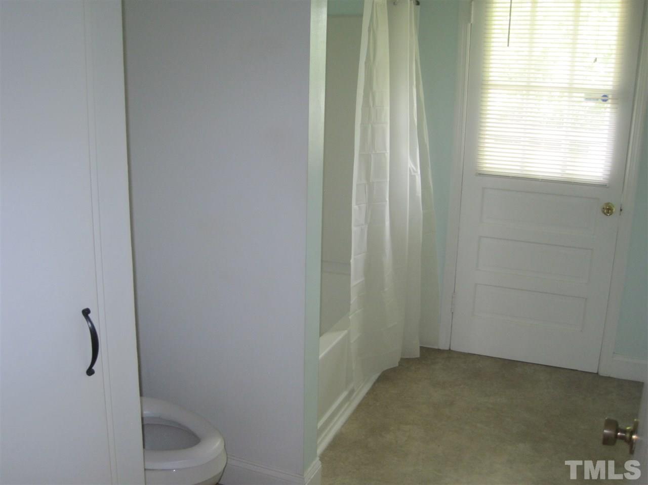 1321 West Core Road Dunn, NC 28334 - Photo 8 of 18 a bathroom with a toilet and sink