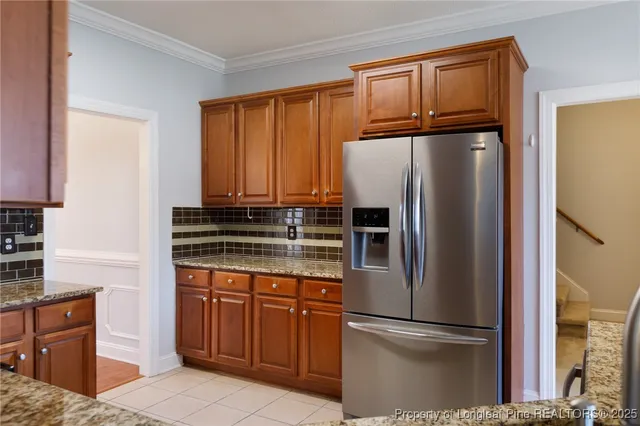 a view of staircase with white walls and door