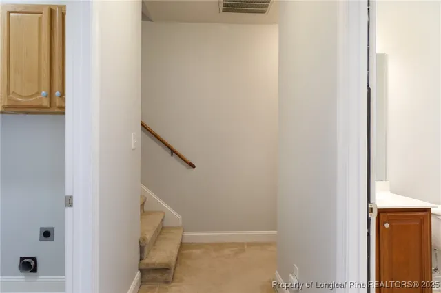 a bathroom with a sink a toilet and a window