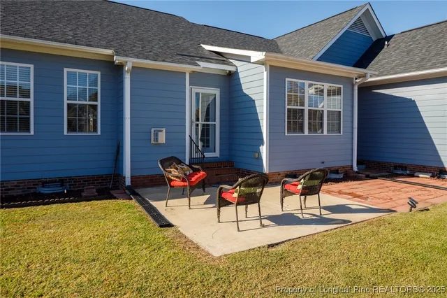 a view of a house with yard and swimming pool