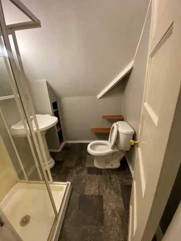 a bathroom with a sink and toilet