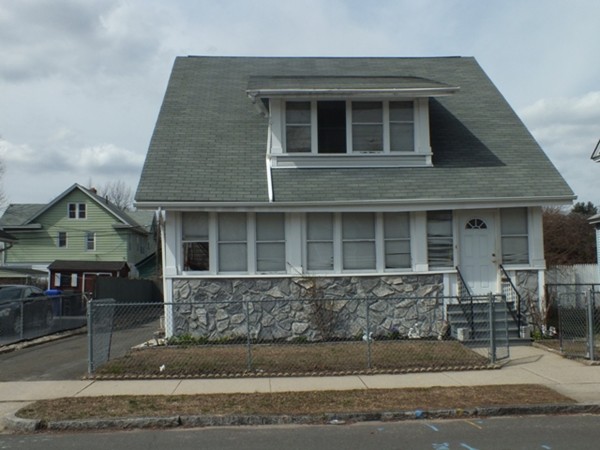 106 Stockman Street Springfield, MA 01104 - Photo 1 of 20 a front view of a house with a yard