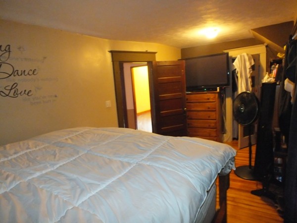 106 Stockman Street Springfield, MA 01104 - Photo 18 of 20 a bedroom with a bed and a mirror