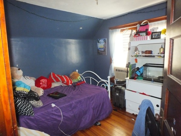 106 Stockman Street Springfield, MA 01104 - Photo 19 of 20 a bedroom with a bed and dresser