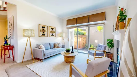 a view of a livingroom with furniture and a window