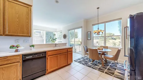 a kitchen with stainless steel appliances granite countertop a refrigerator stove and sink