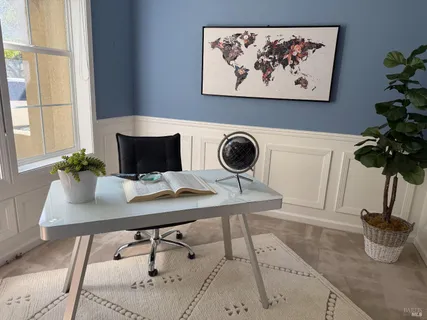a table with a vase and flowers on it