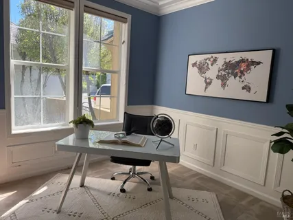 a bedroom with a bed a couch and dresser
