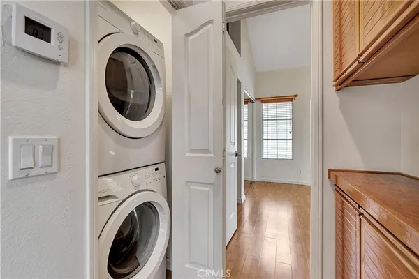 a view of a hallway with washer and dryer