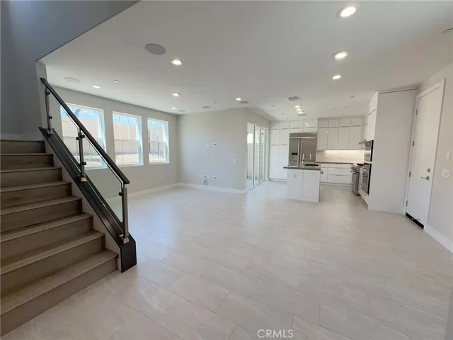 a view of a room with gym equipment and stairs