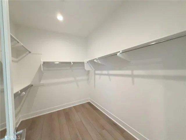 a view of an empty walk in closet