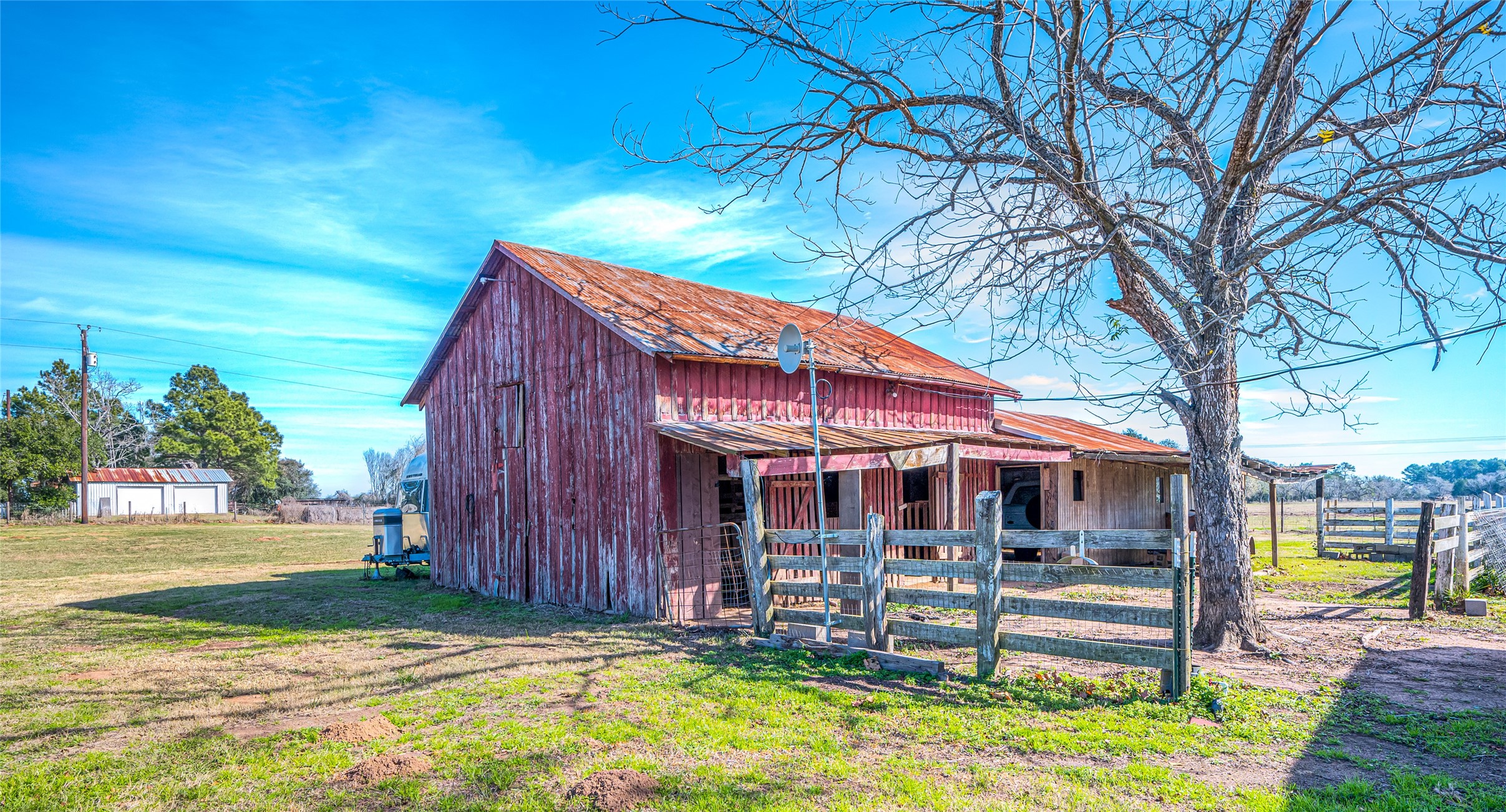 10152 Farm To Market Road 949 Cat Spring, TX 78933 - Photo 12 of 50 a view of a house with backyard porch and sitting area