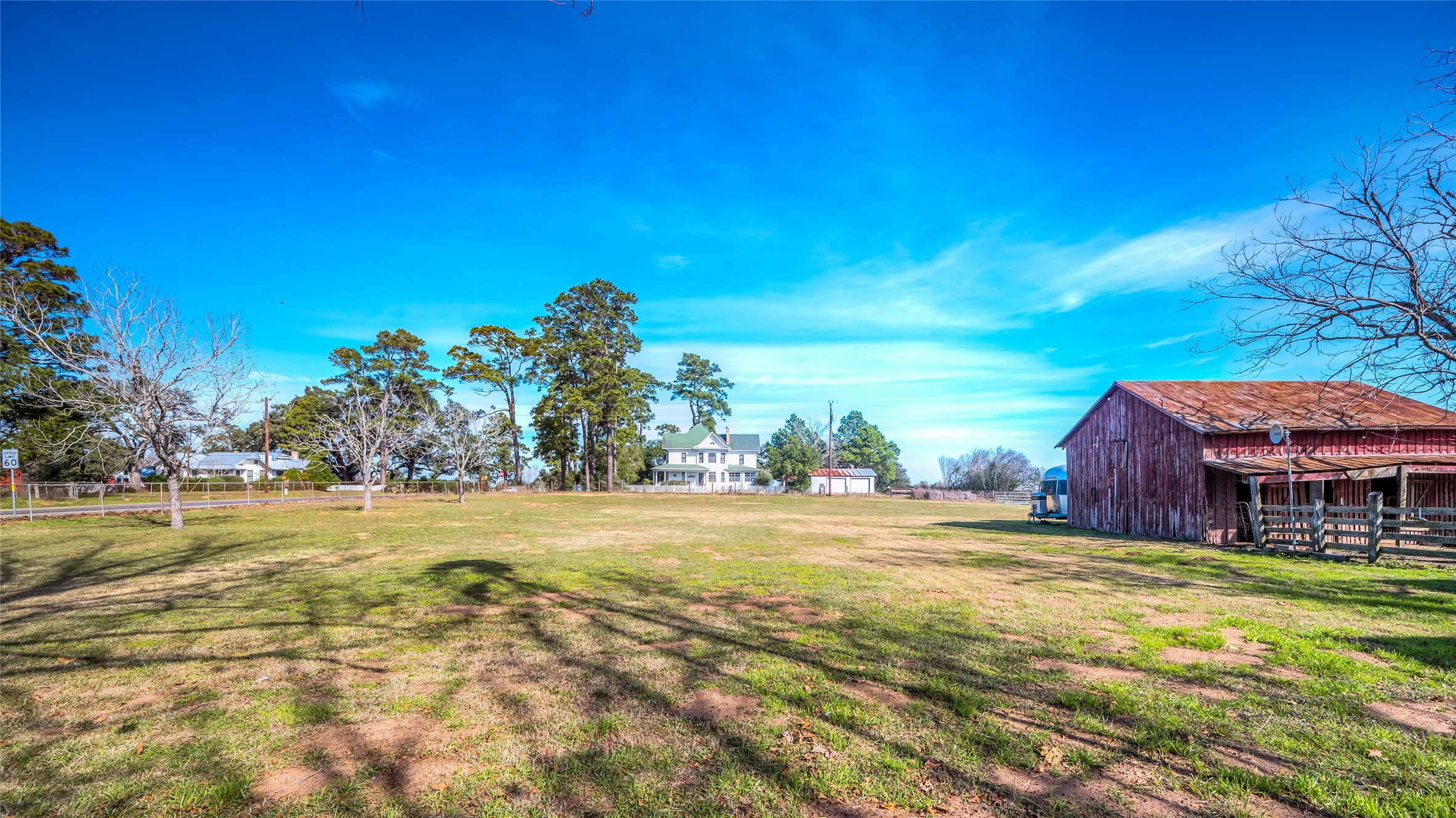 10152 Farm To Market Road 949 Cat Spring, TX 78933 - Photo 14 of 50 a view of a big room with a big yard and large trees