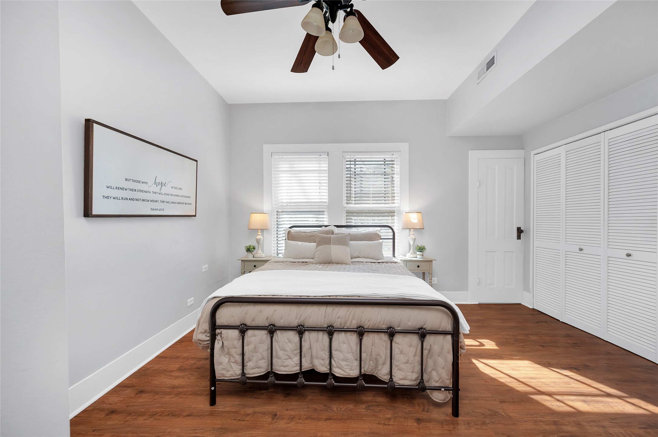 10152 Farm To Market Road 949 Cat Spring, TX 78933 - Photo 29 of 50 a bedroom with a bed and a chandelier
