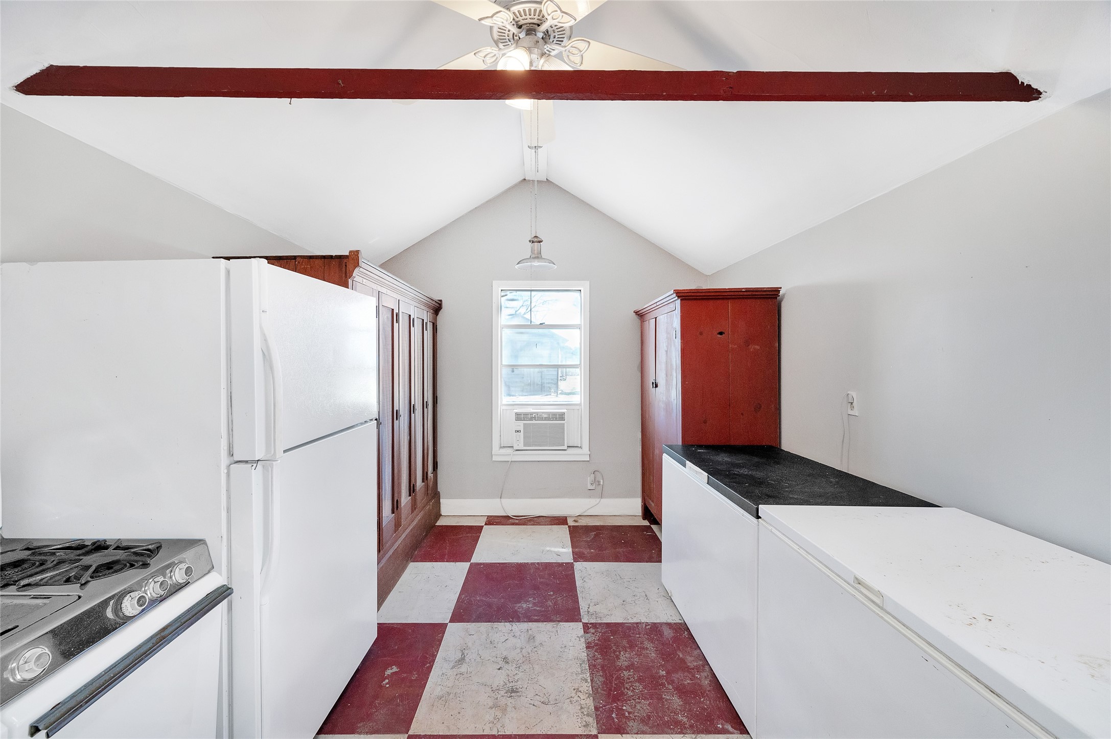 10152 Farm To Market Road 949 Cat Spring, TX 78933 - Photo 42 of 50 a kitchen with a refrigerator and a stove top oven