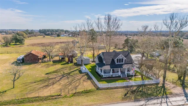 a aerial view of a house with outdoor space lake view and mountain view