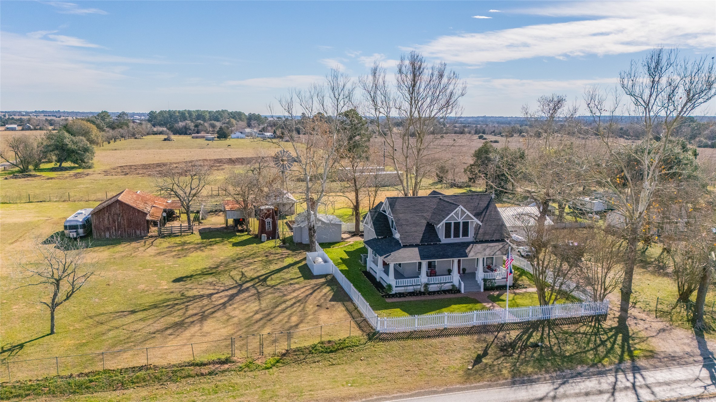 10152 Farm To Market Road 949 Cat Spring, TX 78933 - Photo 43 of 50 a aerial view of a house with outdoor space lake view and mountain view