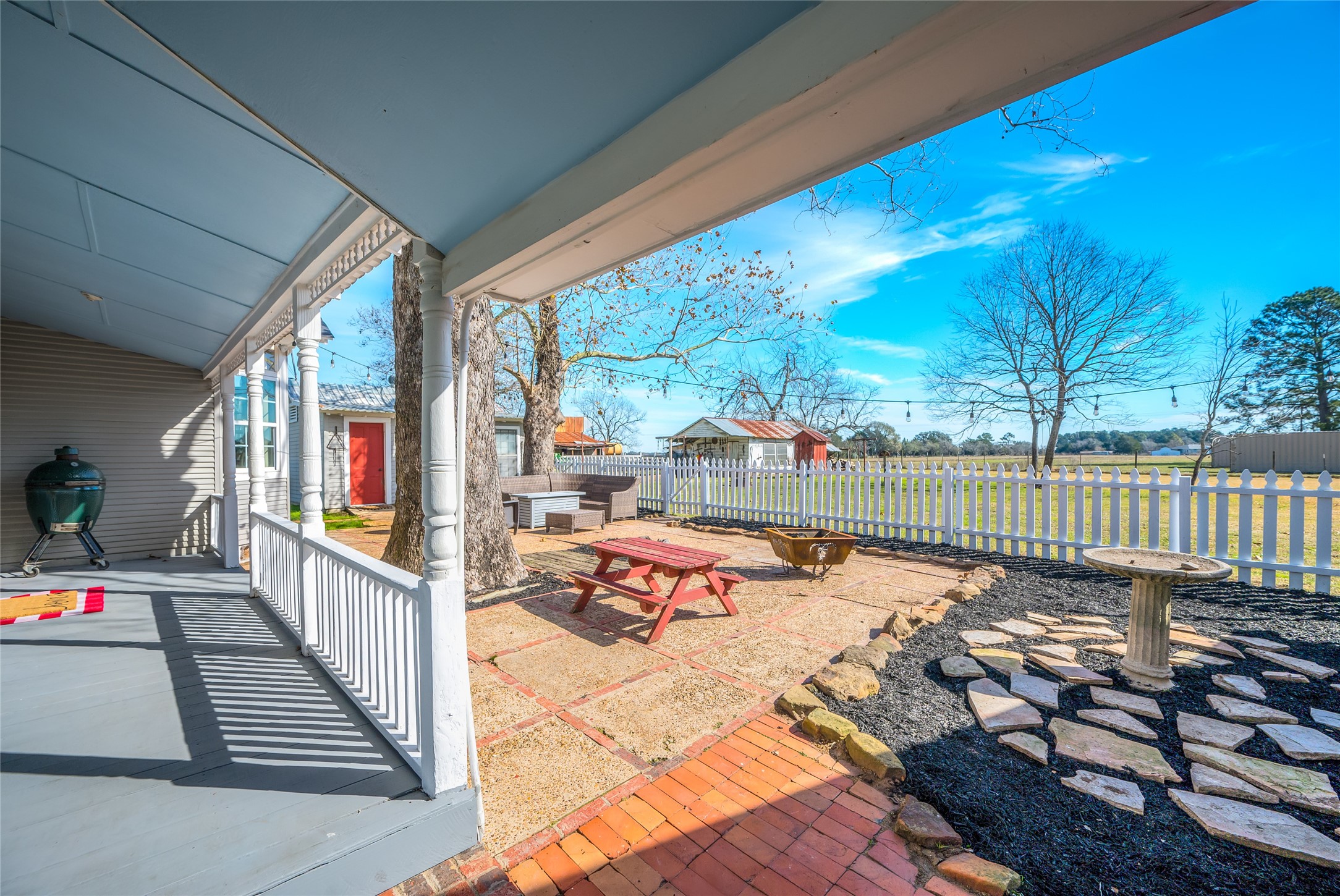 10152 Farm To Market Road 949 Cat Spring, TX 78933 - Photo 10 of 50 a balcony with furniture and wooden floor