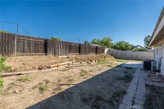 a view of a backyard of the house