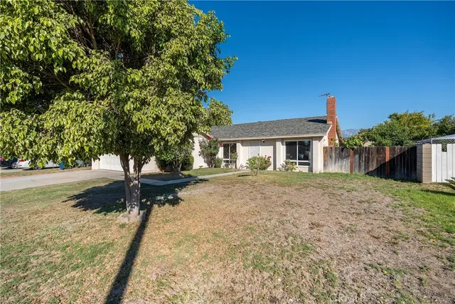 a house with trees in front of it