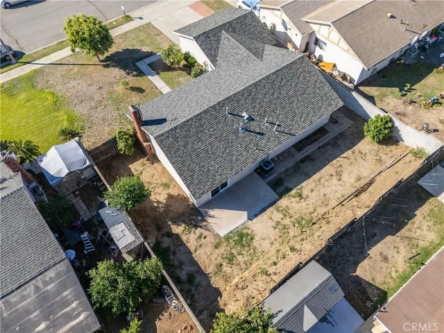 an aerial view of house with yard