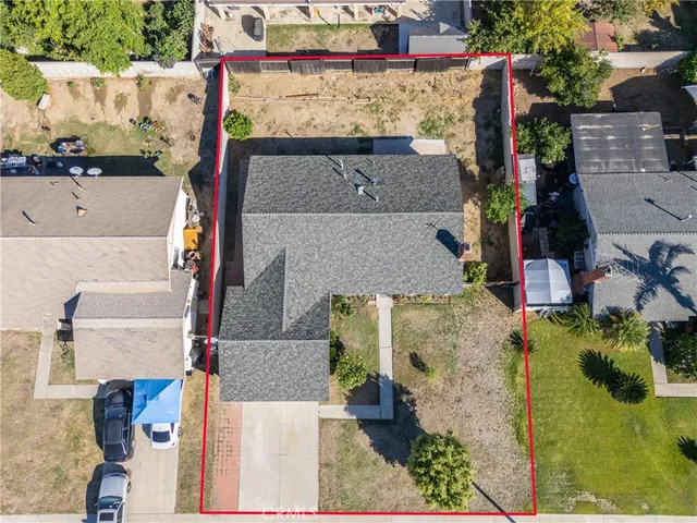 an aerial view of houses with outdoor space
