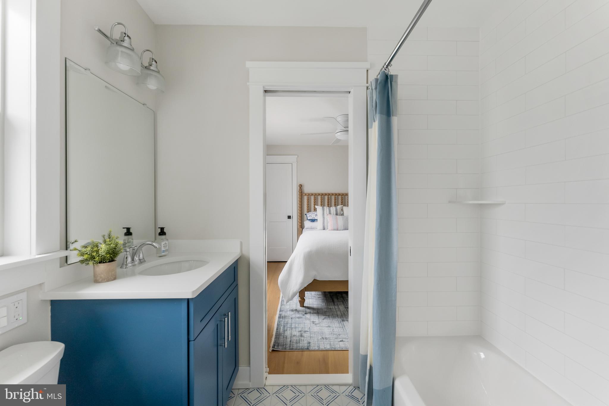 16 67th Street Sea Isle City, NJ 08243 - Photo 12 of 40 a en suite bathroom with a sink and a mirror