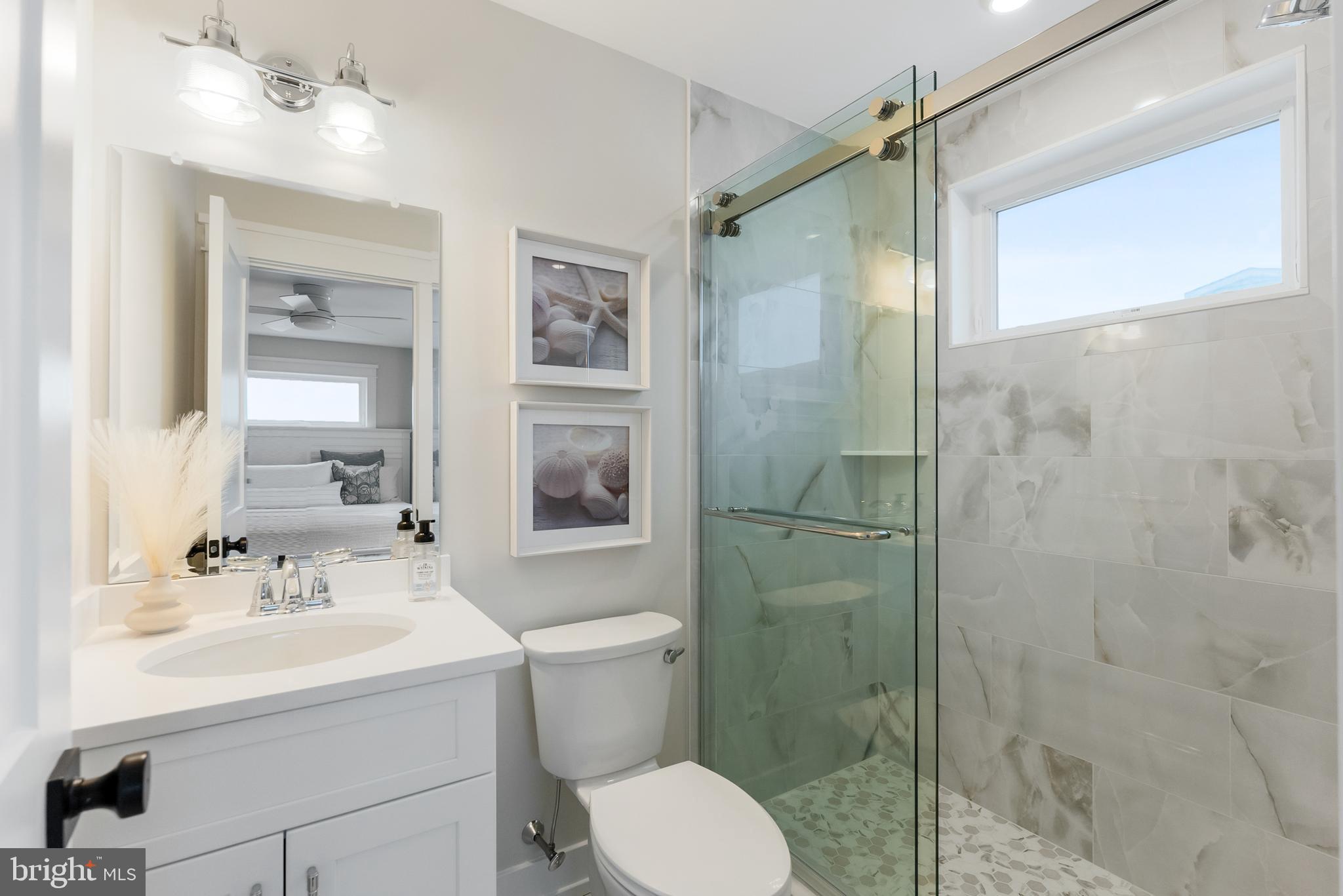 16 67th Street Sea Isle City, NJ 08243 - Photo 17 of 40 a bathroom with a sink toilet and shower